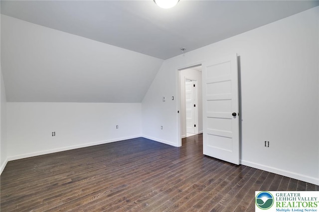 9436 Juniper Dr, Tobyhanna Twp, PA 18466 - additional living space with dark wood-style flooring and vaulted ceiling