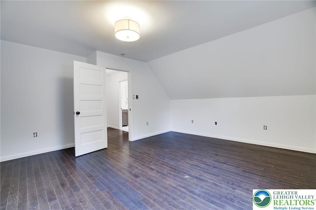 9436 Juniper Dr, Tobyhanna Twp, PA 18466 - additional living space featuring dark wood-style floors and vaulted ceiling