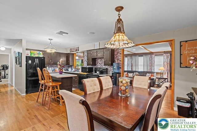 3315 Aspen Rd, Polk Twp, PA 18058 - dining space featuring light wood-type flooring, plenty of natural light, and a chandelier