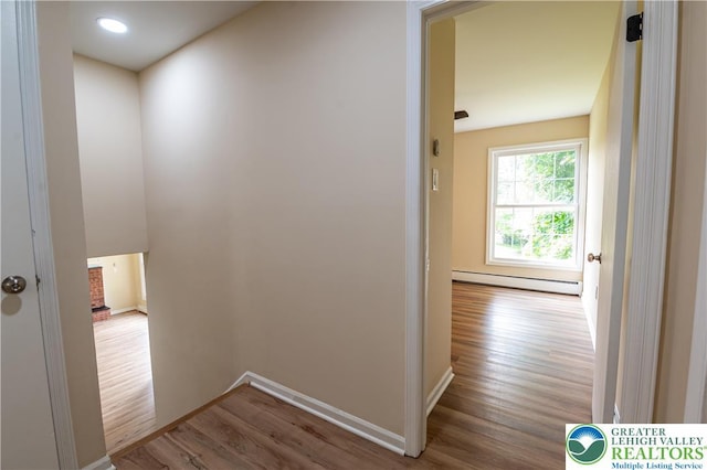 23 Devon Dr, Palmer Twp, PA 18045 - hall with baseboard heating and wood finished floors