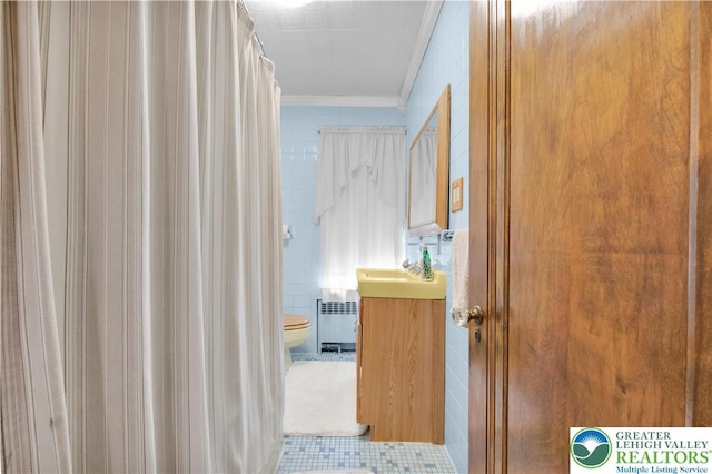 600 S Hoffert St, Fountain Hill Boro, PA 18015 - hall featuring radiator heating unit, ornamental molding, tile walls, and tile patterned flooring