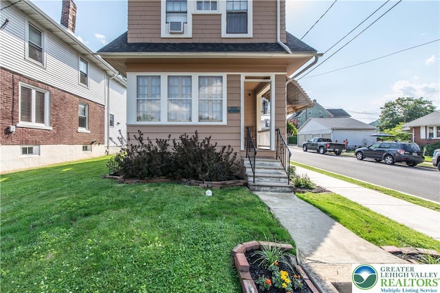 600 S Hoffert St, Fountain Hill Boro, PA 18015 - view of front of property with a front lawn and roof with shingles