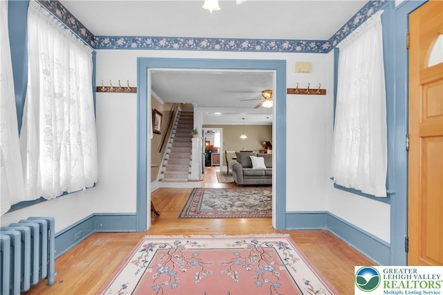 600 S Hoffert St, Fountain Hill Boro, PA 18015 - entrance foyer featuring radiator, a ceiling fan, stairs, and wood finished floors