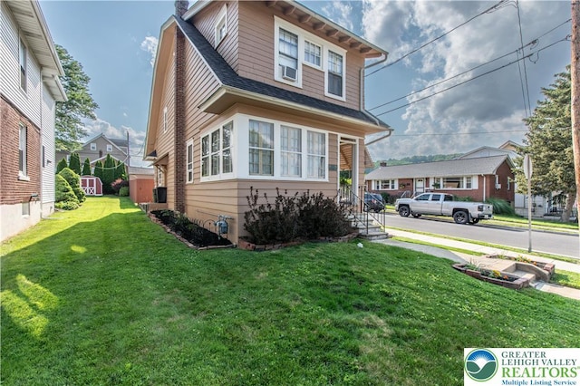 600 S Hoffert St, Fountain Hill Boro, PA 18015 - view of front facade featuring a front yard, roof with shingles, and a chimney