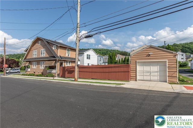 600 S Hoffert St, Fountain Hill Boro, PA 18015 - view of front of home with a detached garage, an outbuilding, and concrete driveway