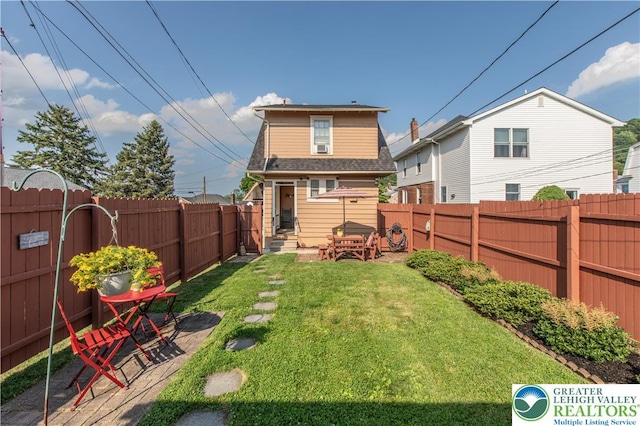 600 S Hoffert St, Fountain Hill Boro, PA 18015 - rear view of house featuring a fenced backyard and a shingled roof