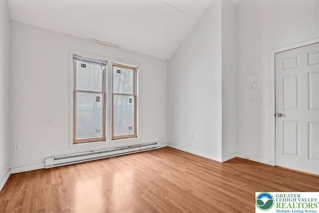 417 Hickory Dr, Jackson Twp, PA 18372 - unfurnished room with baseboard heating, wood finished floors, and vaulted ceiling