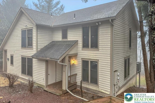 417 Hickory Dr, Jackson Twp, PA 18372 - rear view of house featuring roof with shingles