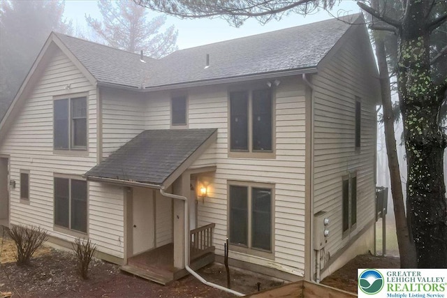 417 Hickory Dr, Jackson Twp, PA 18372 - back of house featuring roof with shingles