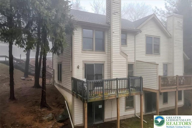 417 Hickory Dr, Jackson Twp, PA 18372 - back of house featuring a chimney