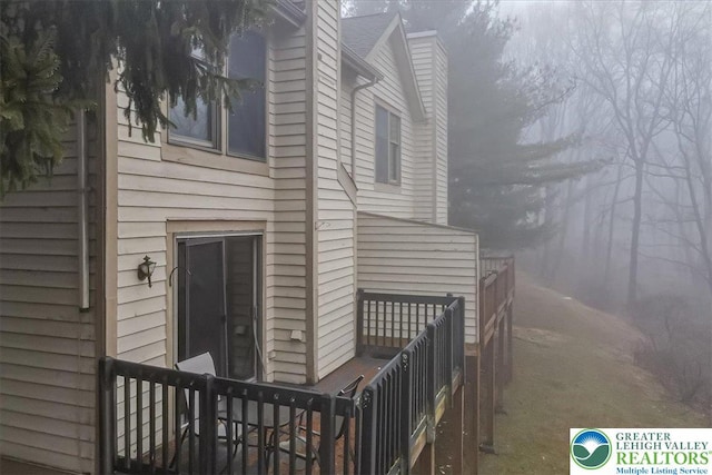 417 Hickory Dr, Jackson Twp, PA 18372 - view of side of home with a chimney