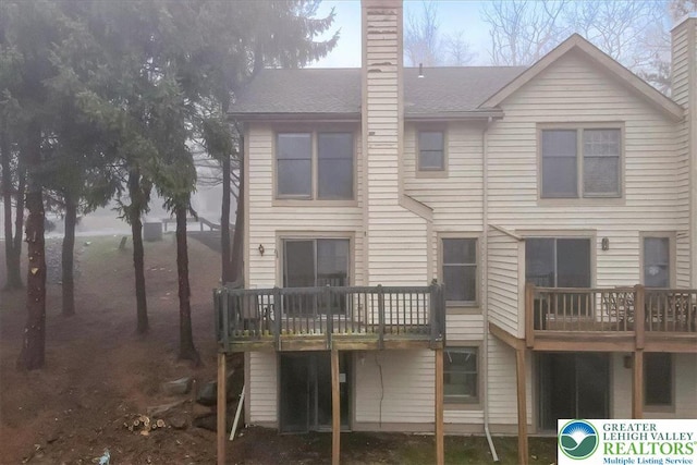 417 Hickory Dr, Jackson Twp, PA 18372 - back of property featuring a chimney and a deck