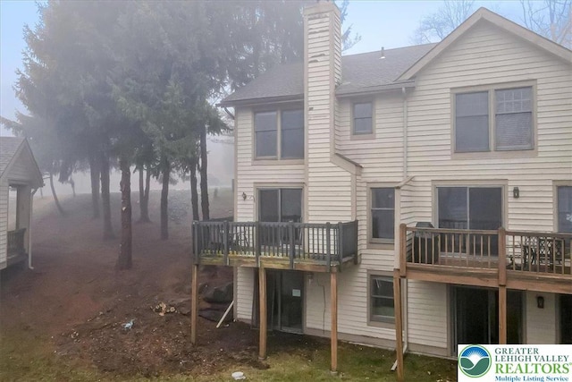 417 Hickory Dr, Jackson Twp, PA 18372 - back of property featuring a chimney and a deck