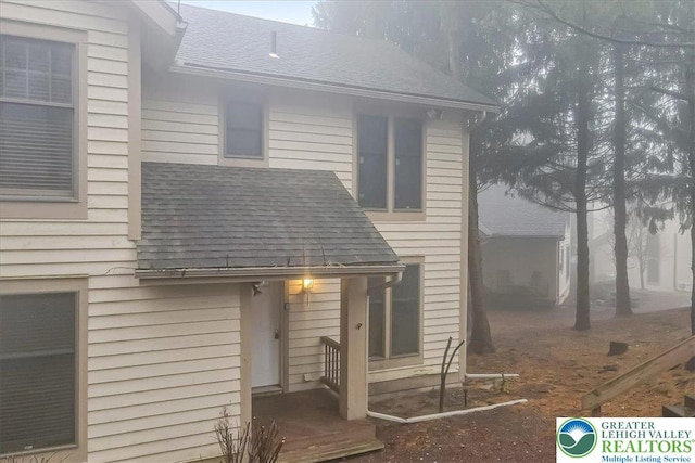 417 Hickory Dr, Jackson Twp, PA 18372 - rear view of property featuring roof with shingles