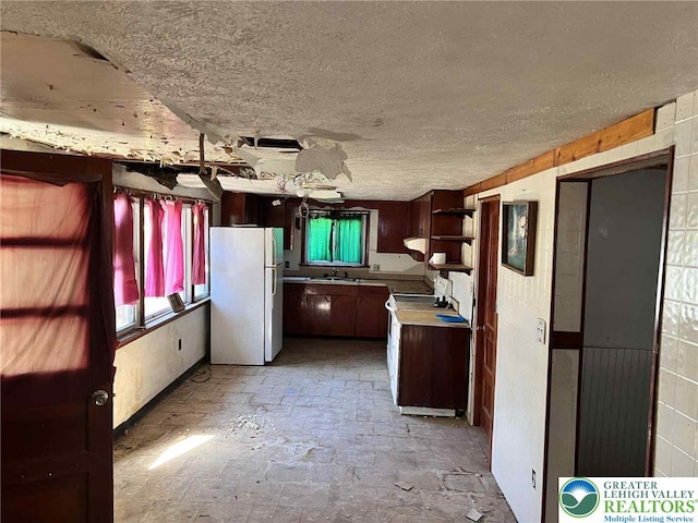 22 Fetherman, Stroudsburg, PA 18360 - kitchen with freestanding refrigerator, stove, open shelves, a textured ceiling, and light countertops