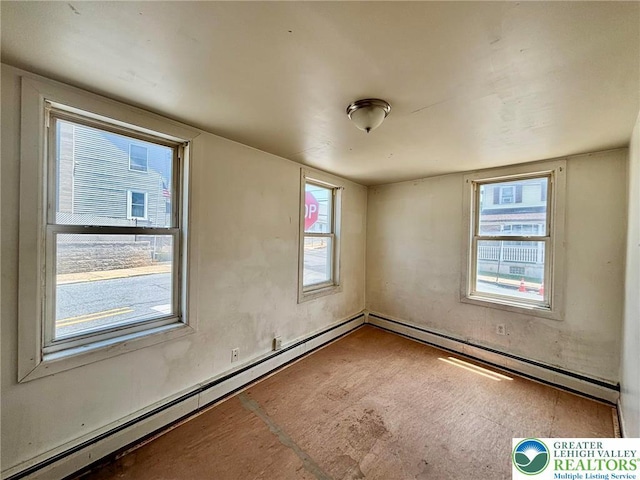 342 Race St, Catasauqua Borough, PA 18032 - empty room with a baseboard radiator and healthy amount of natural light