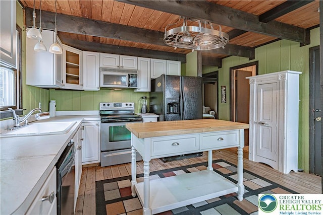 115 Lookout Ct, Middle Smithfield Twp, PA 18302 - kitchen featuring black appliances, light wood-type flooring, white cabinetry, a wooden ceiling with exposed beams, and glass insert cabinets