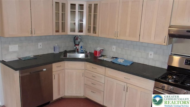 139 N 11th St, Allentown City, PA 18102 - kitchen with stainless steel gas stove, backsplash, glass insert cabinets, and dark countertops