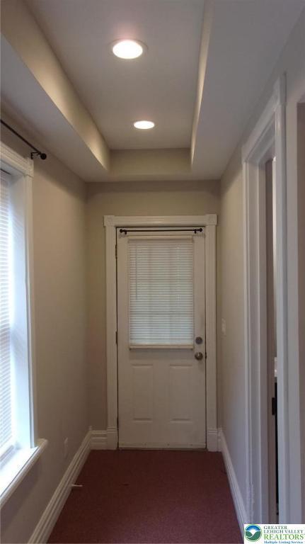139 N 11th St, Allentown City, PA 18102 - doorway to outside with carpet and a raised ceiling