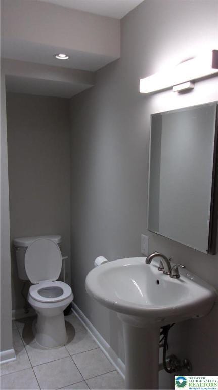139 N 11th St, Allentown City, PA 18102 - half bath with toilet and tile patterned floors