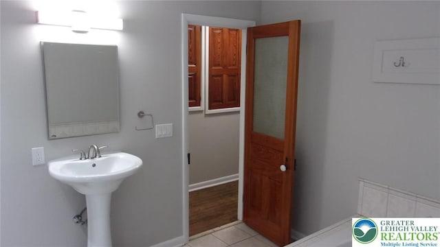 139 N 11th St, Allentown City, PA 18102 - bathroom with tile patterned flooring and a sink