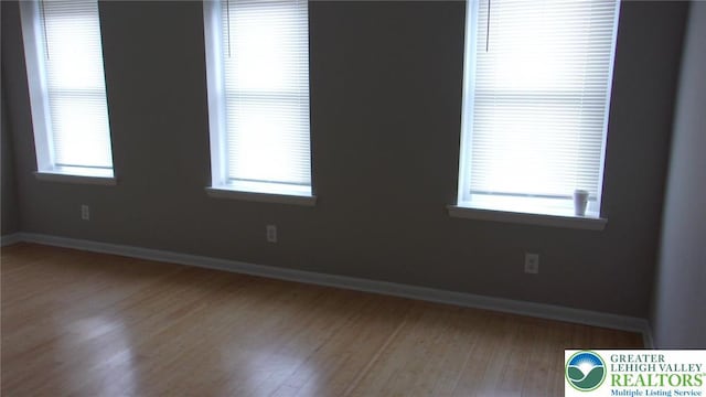 139 N 11th St, Allentown City, PA 18102 - spare room featuring wood finished floors and healthy amount of natural light