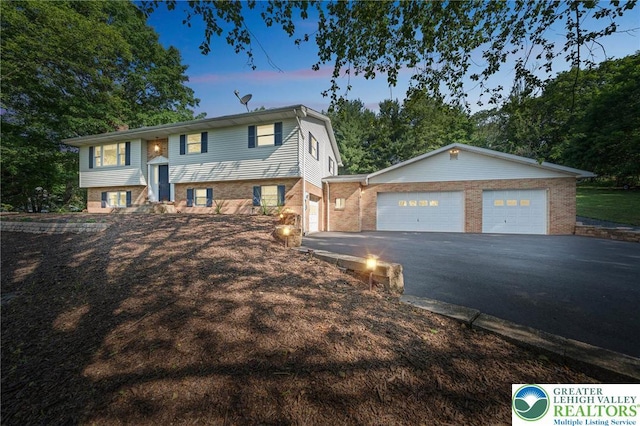 2922 Dogwood Dr, Coopersburg Boro, PA 18036 - view of front of home with asphalt driveway and brick siding