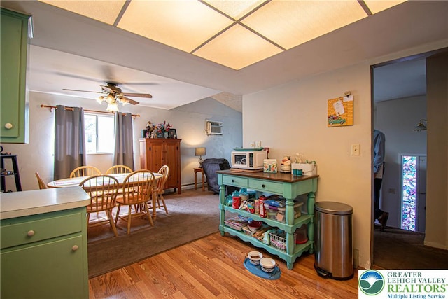 1208 E Susquehanna St, Salisbury Twp, PA 18103 - dining space with light wood-style flooring, a ceiling fan, and a wall mounted air conditioner