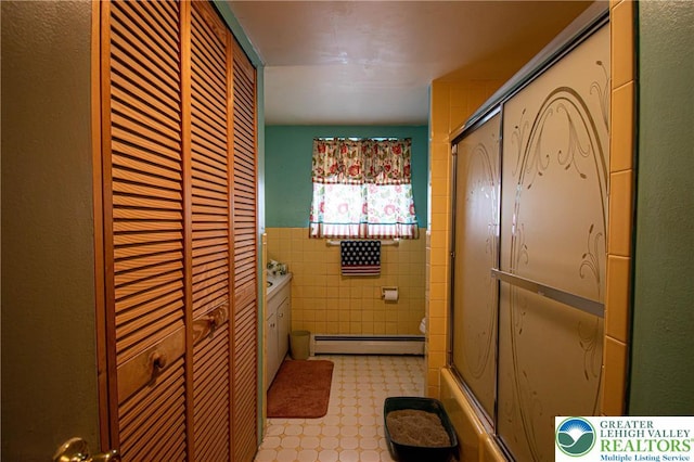 1208 E Susquehanna St, Salisbury Twp, PA 18103 - full bathroom with a closet, tile walls, a baseboard heating unit, and wainscoting