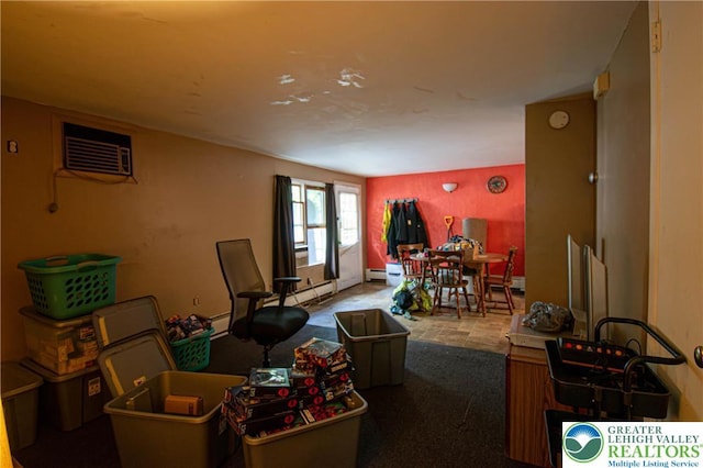 1208 E Susquehanna St, Salisbury Twp, PA 18103 - living room featuring a wall unit AC, a baseboard radiator, and carpet