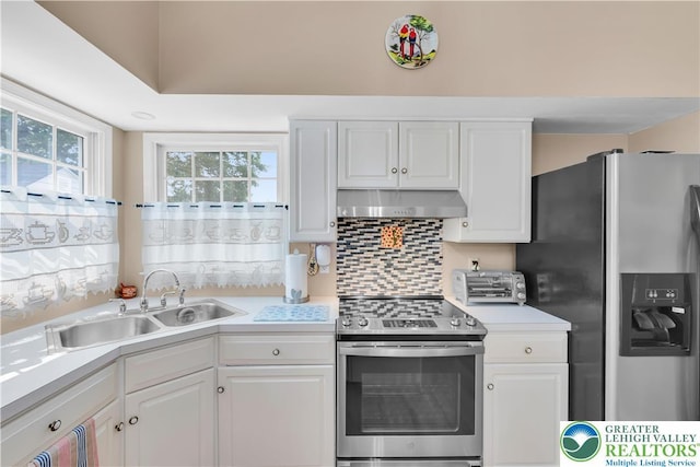 3780 Barlow Pl, Bethlehem Twp, PA 18020 - kitchen with stainless steel appliances, ventilation hood, white cabinets, and light countertops