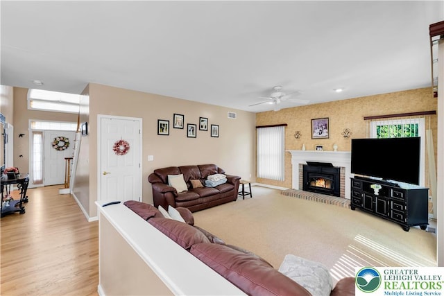 3780 Barlow Pl, Bethlehem Twp, PA 18020 - living area with ceiling fan, a brick fireplace, and light wood-style floors