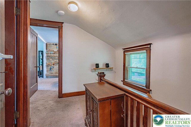 636 School Rd, Plainfield Twp, PA 18064 - hallway with lofted ceiling and light carpet