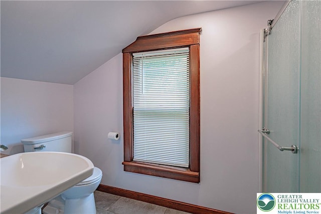 636 School Rd, Plainfield Twp, PA 18064 - full bathroom with vaulted ceiling, an enclosed shower, and tile patterned flooring
