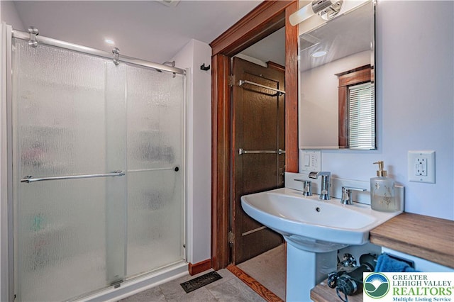 636 School Rd, Plainfield Twp, PA 18064 - bathroom with a shower stall and tile patterned flooring