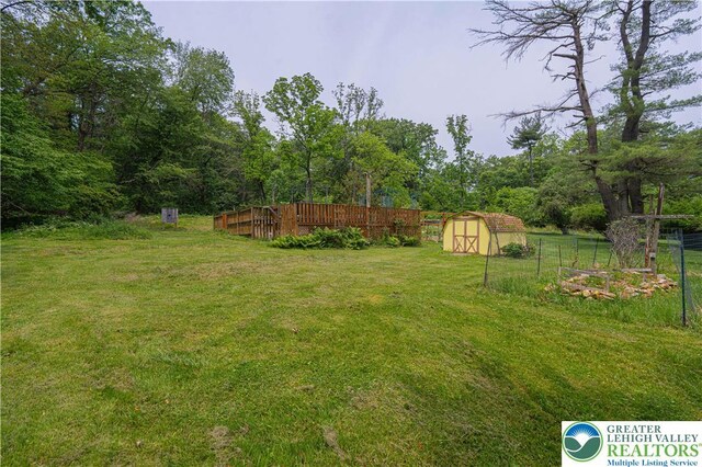 636 School Rd, Plainfield Twp, PA 18064 - view of yard with a shed and a deck