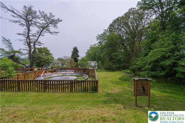 636 School Rd, Plainfield Twp, PA 18064 - view of grassy yard featuring a deck