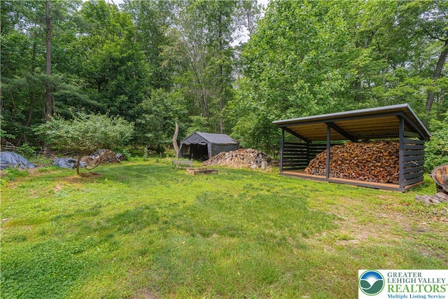 636 School Rd, Plainfield Twp, PA 18064 - view of grassy yard featuring an outbuilding and a pole building