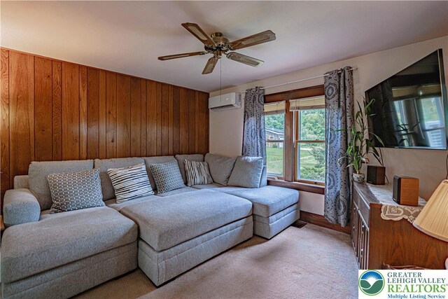 636 School Rd, Plainfield Twp, PA 18064 - living room featuring a wall unit AC, wooden walls, and ceiling fan