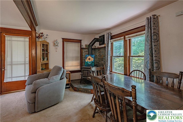636 School Rd, Plainfield Twp, PA 18064 - dining space with a wood stove and carpet floors