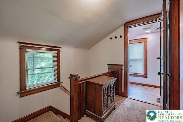 636 School Rd, Plainfield Twp, PA 18064 - corridor with an upstairs landing, vaulted ceiling, and light colored carpet