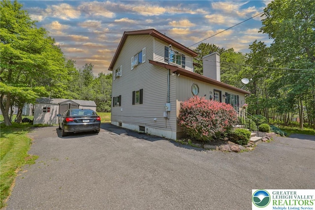 179 Chippewa Trl, Penn Forest Twp, PA 18210 - view of property exterior with a chimney