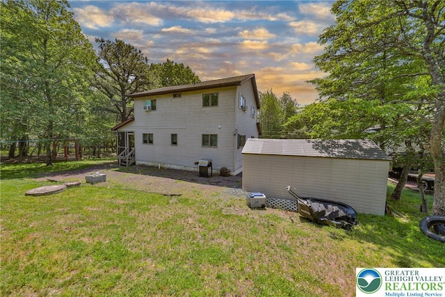 179 Chippewa Trl, Penn Forest Twp, PA 18210 - back of property with a lawn and a storage shed