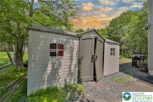 179 Chippewa Trl, Penn Forest Twp, PA 18210 - outdoor structure at dusk featuring a storage unit