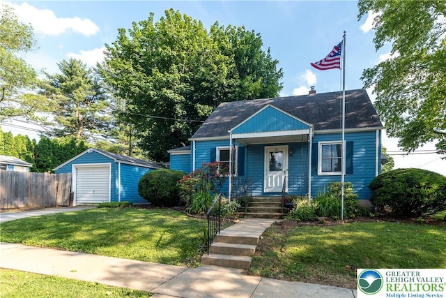 321 Willow Rd, Hellertown Borough, PA 18055 - bungalow-style house with driveway, a detached garage, an outdoor structure, covered porch, and a shingled roof