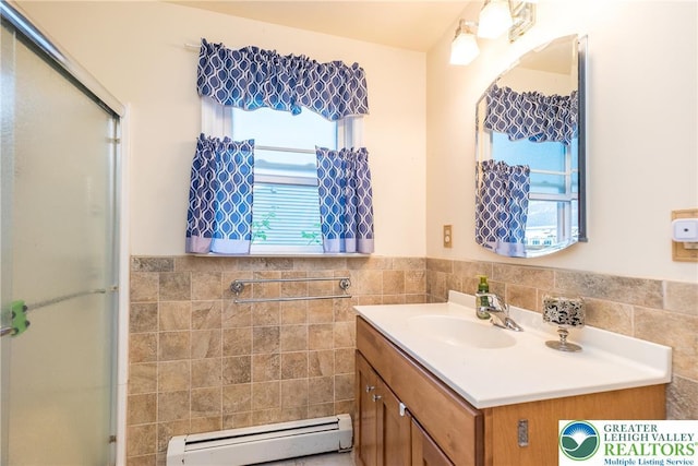 321 Willow Rd, Hellertown Borough, PA 18055 - bathroom with a baseboard radiator, tile walls, vanity, wainscoting, and an enclosed shower
