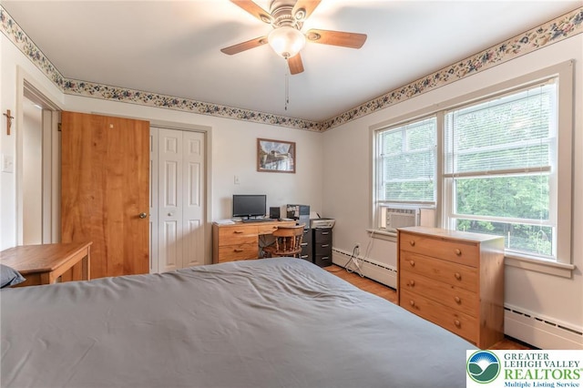 1571 Penn Dr, West Penn Twp, PA 18211 - bedroom featuring a baseboard heating unit, multiple windows, and a closet