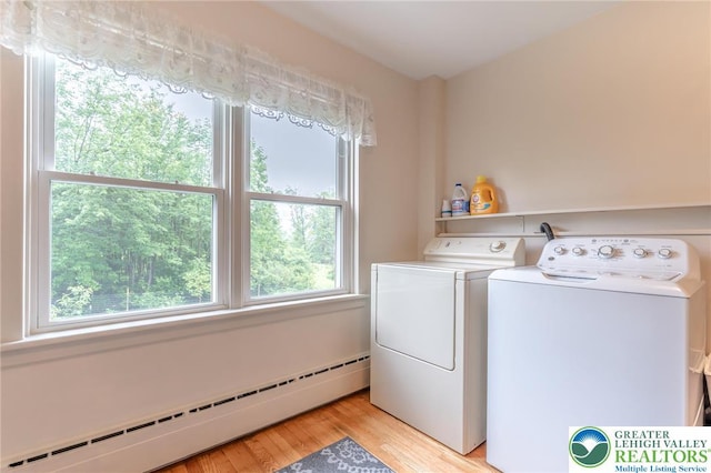 1571 Penn Dr, West Penn Twp, PA 18211 - washroom featuring a baseboard radiator, washing machine and dryer, and light wood finished floors