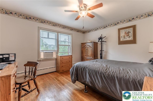 1571 Penn Dr, West Penn Twp, PA 18211 - bedroom featuring a baseboard radiator, light wood-type flooring, and a ceiling fan