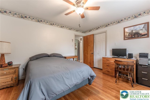 1571 Penn Dr, West Penn Twp, PA 18211 - bedroom with light wood-style flooring, a closet, a ceiling fan, and a desk